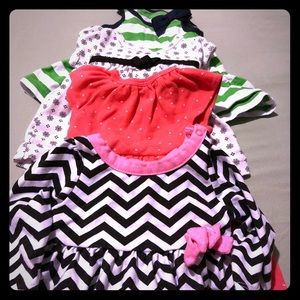 Bundle of newborn baby dresses